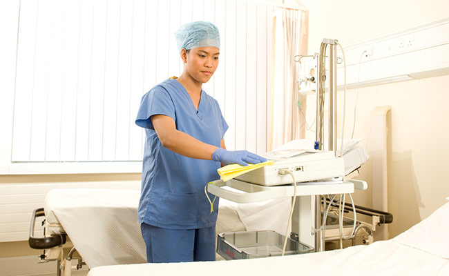 A Girl Cleaning Hospital Equipments