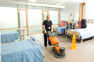 A Derrycourt staff member Cleaning Floor in Hospital