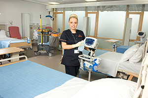 A Derrycourt staff member Cleaning the Hospital Equipment