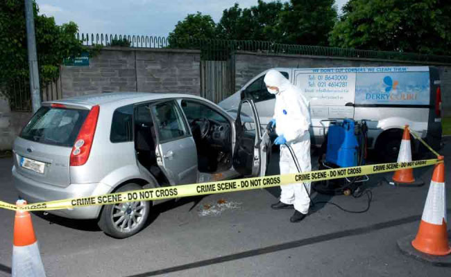 Derrycourt Cleaning Staff on Crime Scene Cleaning a Car