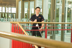 A Staff member of Derrycourt Cleaning the Floor